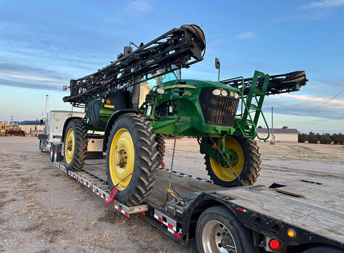 Self Propelled John Deere Sprayer on Trailer